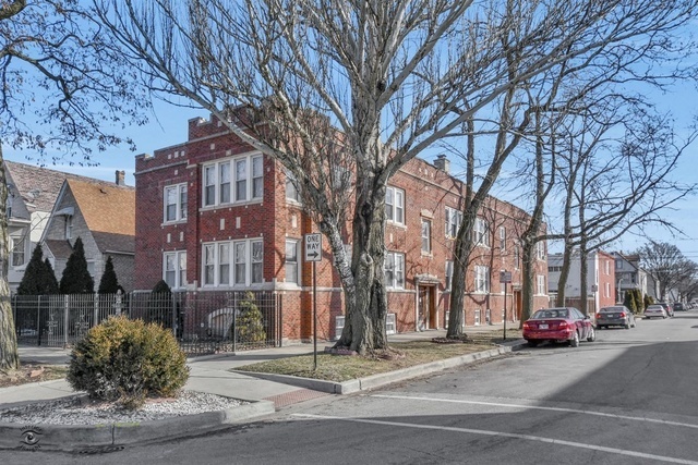 a view of a street with a building in the background