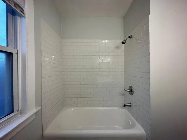 a close up of a bathtub in a bathroom