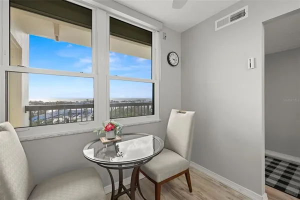 a kitchen with a sink cabinets and a window