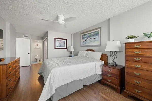 a bed room with a bed and a lamp