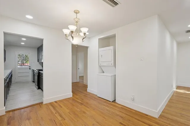 a kitchen with stainless steel appliances granite countertop a sink and stove