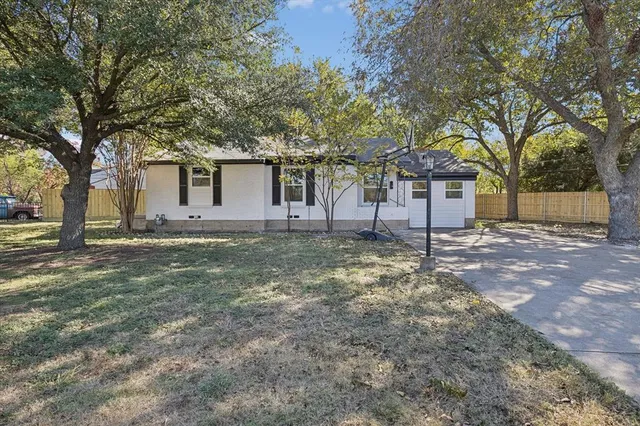 a backyard of a house with yard and outdoor seating
