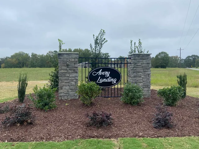 a view of a garden with sitting area