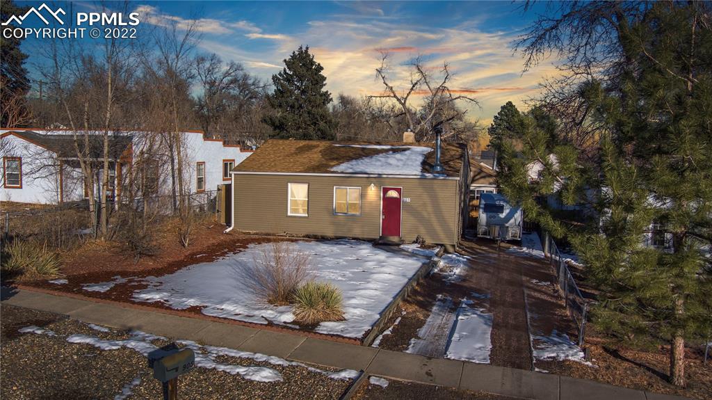 905 Prairie Road Colorado Springs, CO 80909 - Photo 1 of 21 a view of a house with a yard