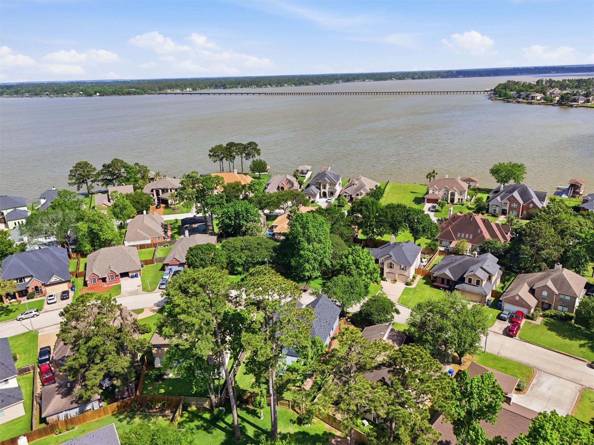 8827 Mile Run Road Humble, TX 77346 - Photo 33 of 37 a view of a lake with a lake view