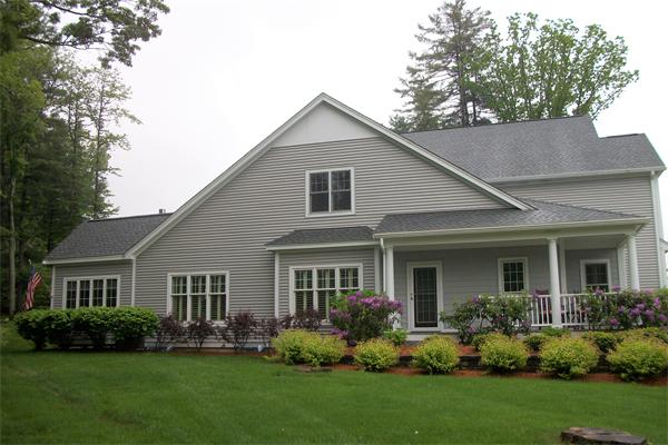 8 Sauta Farm Way, Unit 8 Hudson, MA 01749 - Photo 30 of 30 a front view of a house with a garden and yard