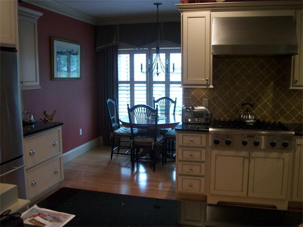8 Sauta Farm Way, Unit 8 Hudson, MA 01749 - Photo 6 of 30 a kitchen with appliances cabinets and a table