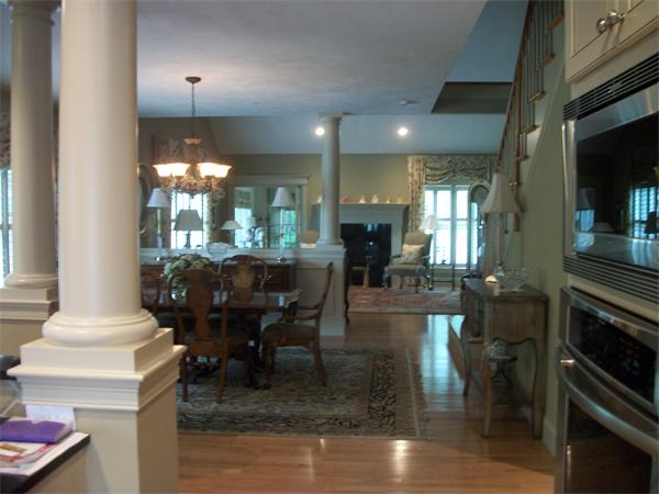 8 Sauta Farm Way, Unit 8 Hudson, MA 01749 - Photo 9 of 30 a dining room with furniture and a chandelier