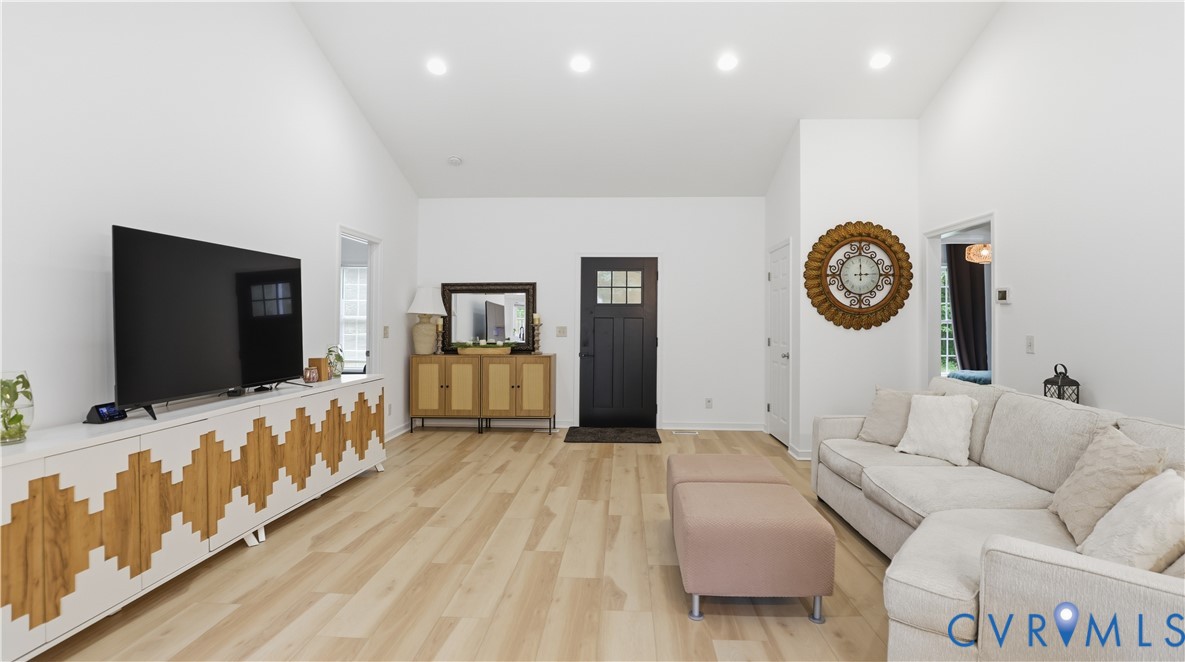 2406 Emanuel Church Road Powhatan, VA 23139 - Photo 8 of 48 Spacious living area featuring light wood-finish f