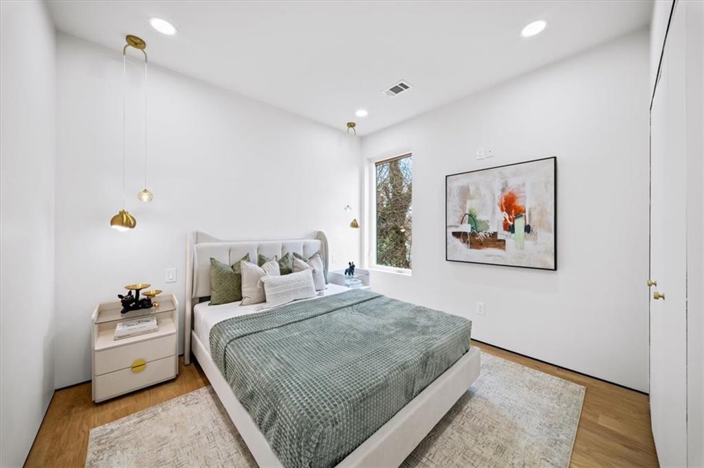 172 Racine Street Southwest Atlanta, GA 30314 - Photo 12 of 32 a bedroom with a bed and a couch