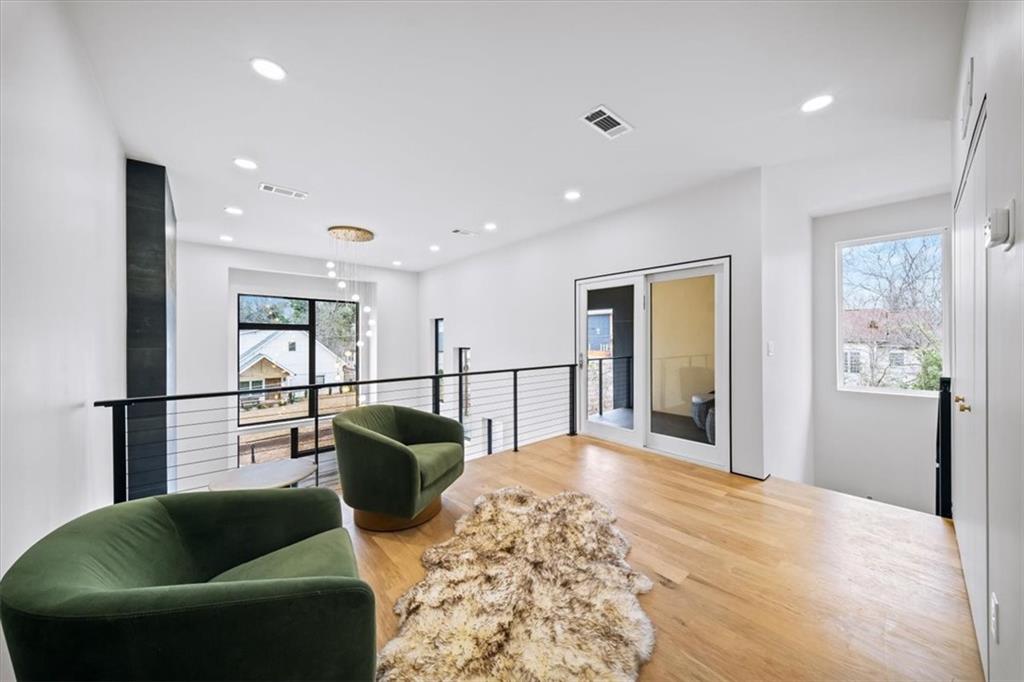 172 Racine Street Southwest Atlanta, GA 30314 - Photo 17 of 32 a kitchen with stainless steel appliances kitchen island granite countertop a refrigerator and a sink