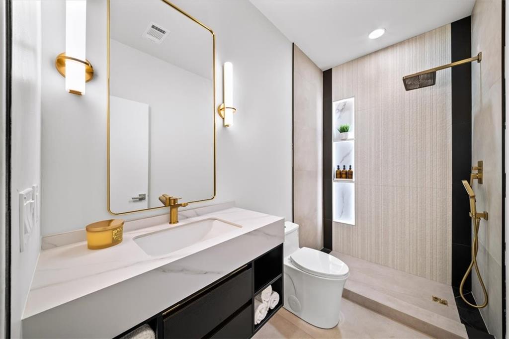 172 Racine Street Southwest Atlanta, GA 30314 - Photo 25 of 32 a bathroom with a sink a toilet and shower