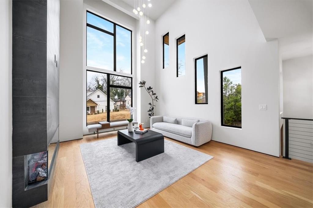 172 Racine Street Southwest Atlanta, GA 30314 - Photo 6 of 32 a living room with furniture and a large window