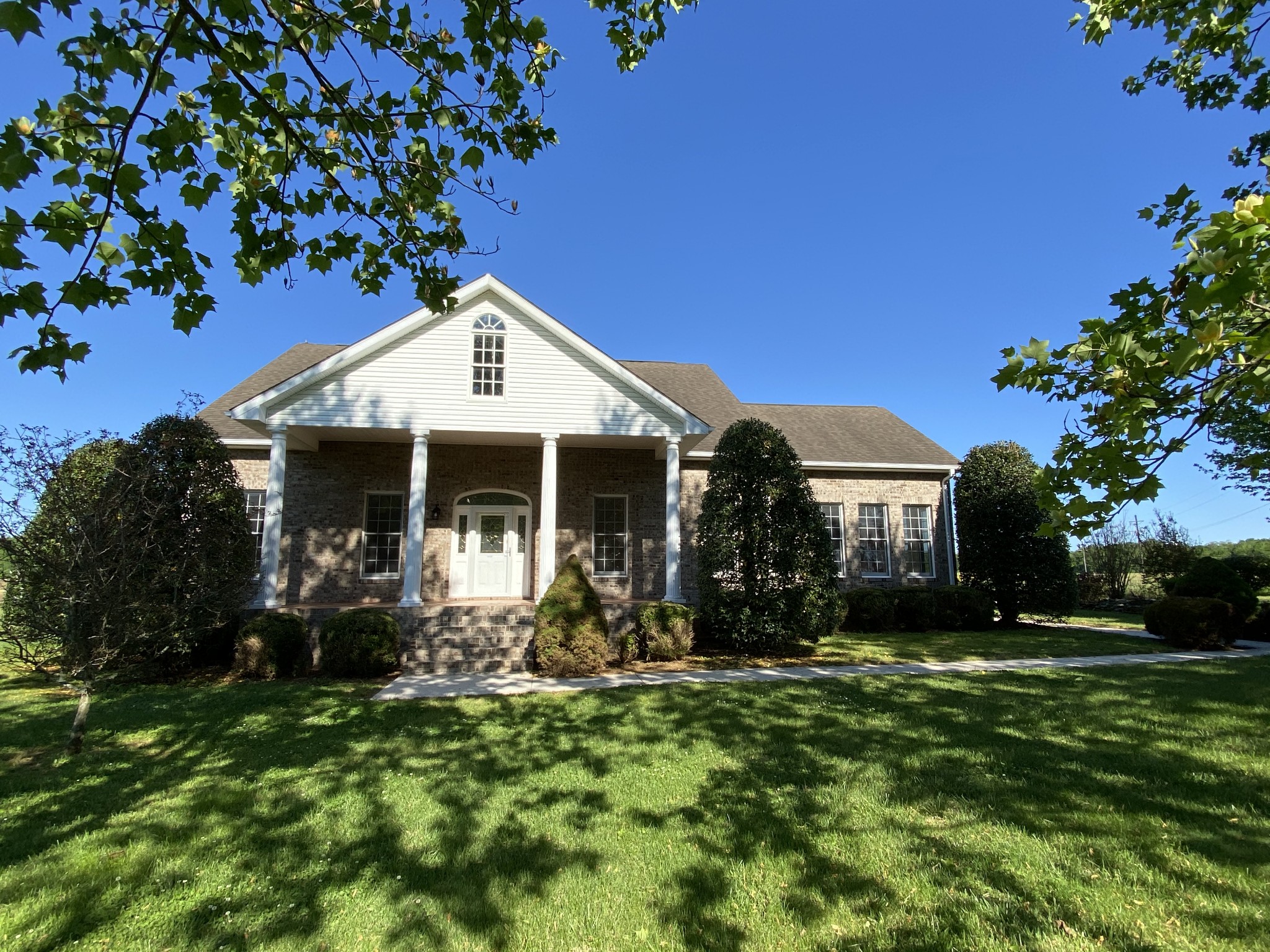1370 Shelly Road Decherd, TN 37324 - Photo 1 of 44 a front view of a house with garden