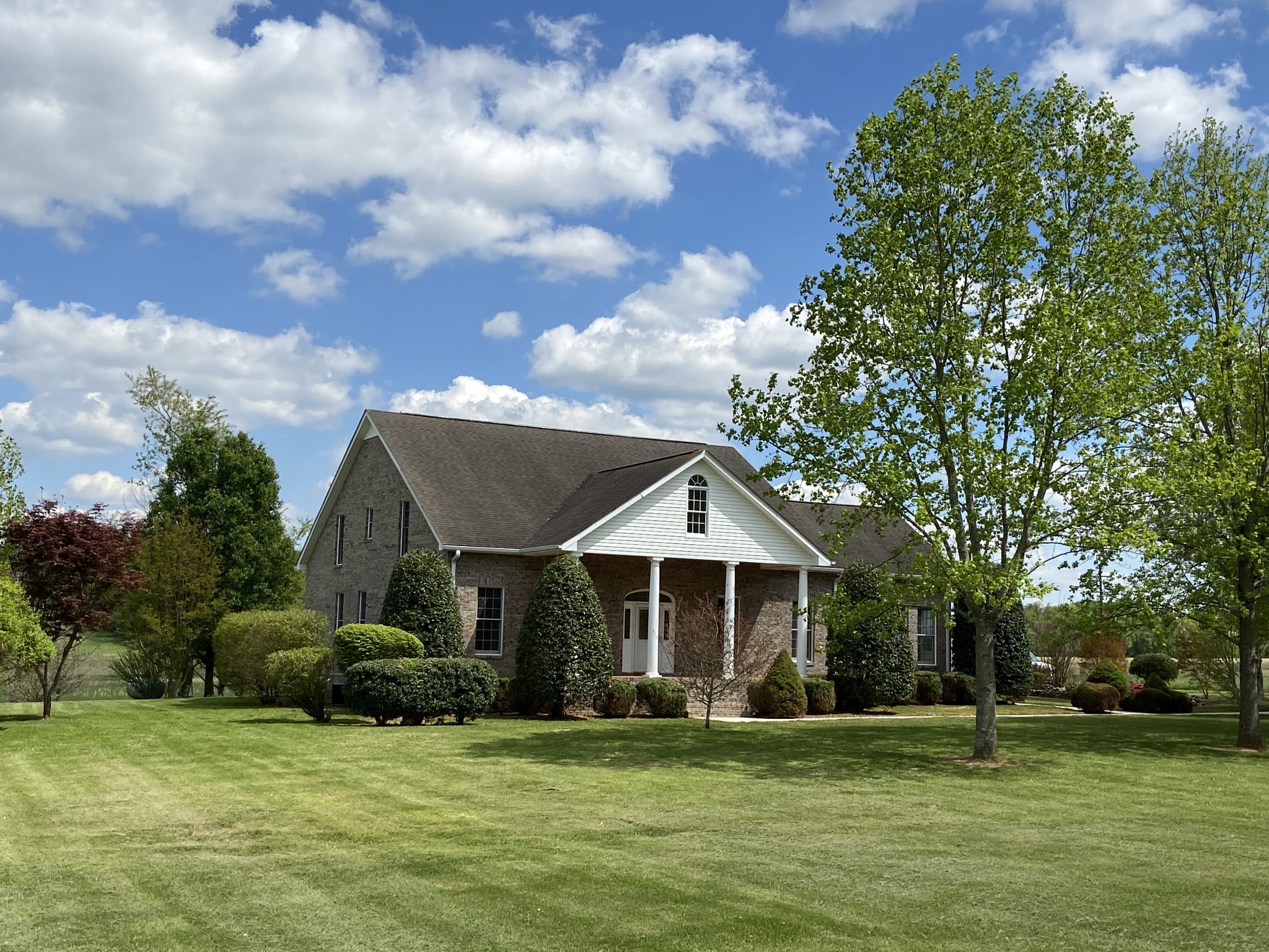 1370 Shelly Road Decherd, TN 37324 - Photo 2 of 44 a front view of a house with a garden