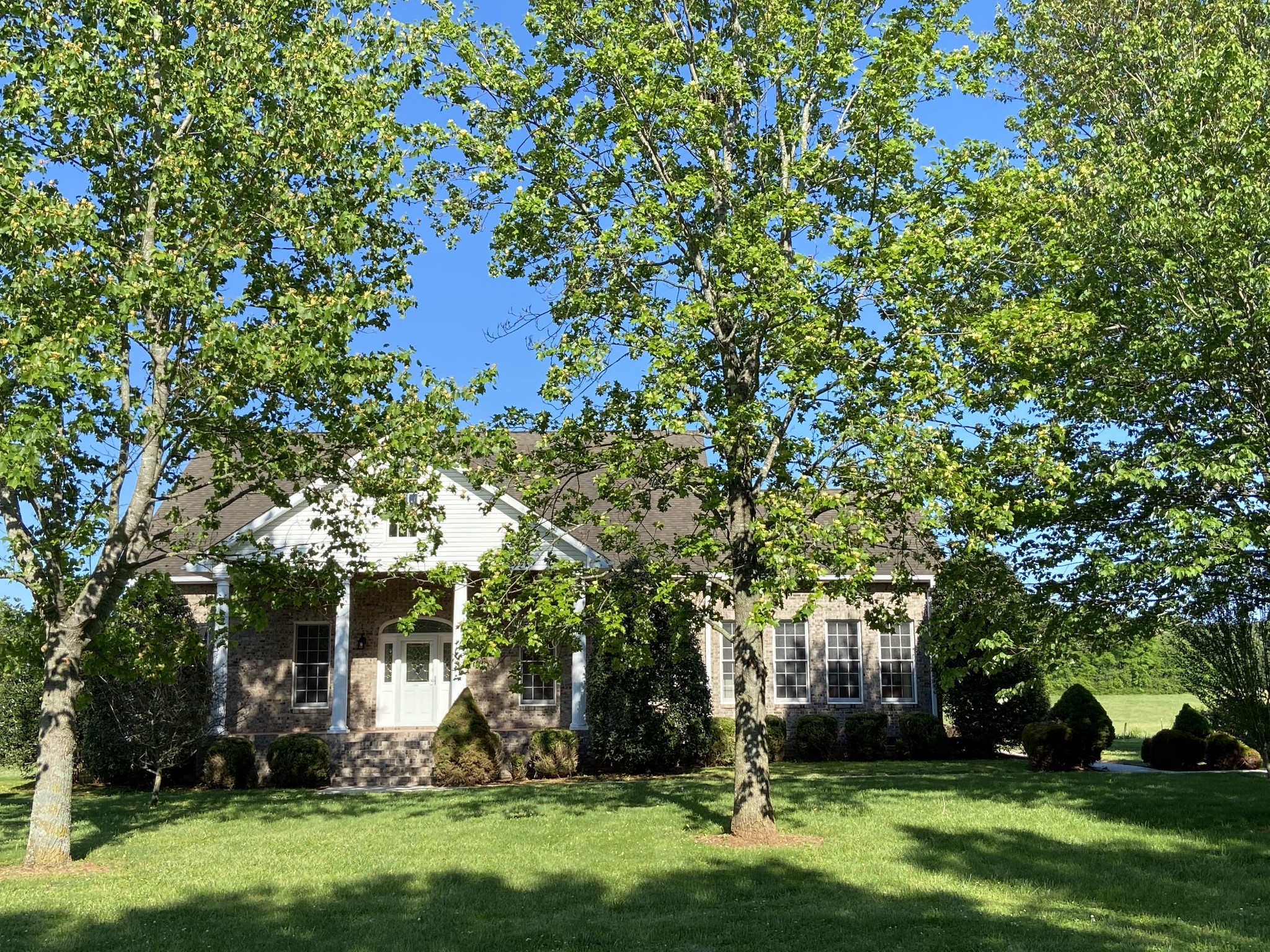 1370 Shelly Road Decherd, TN 37324 - Photo 14 of 44 a view of a backyard with a garden