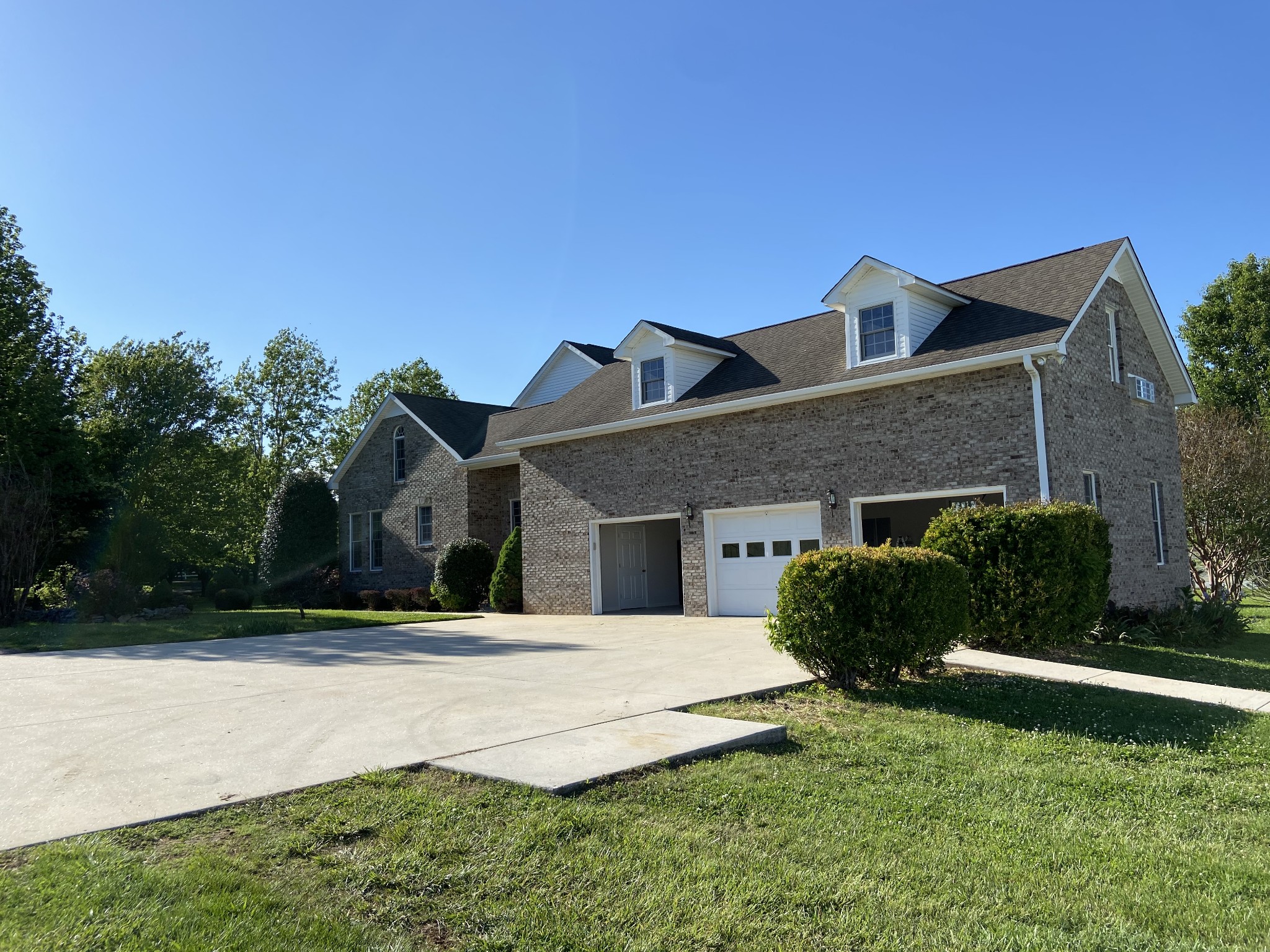 1370 Shelly Road Decherd, TN 37324 - Photo 16 of 44 a front view of a house with a yard