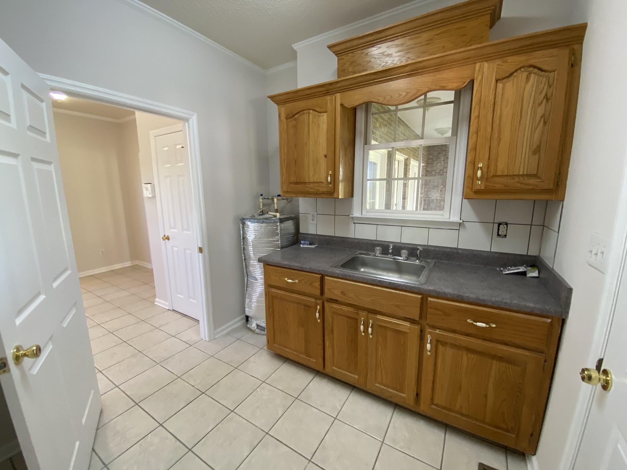 1370 Shelly Road Decherd, TN 37324 - Photo 18 of 44 a spacious bathroom with a granite countertop sink and a mirror