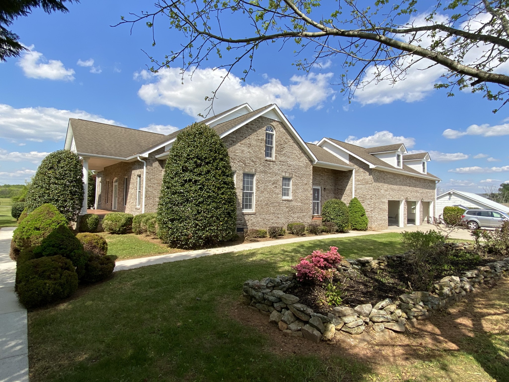 1370 Shelly Road Decherd, TN 37324 - Photo 3 of 44 a front view of a house with a yard