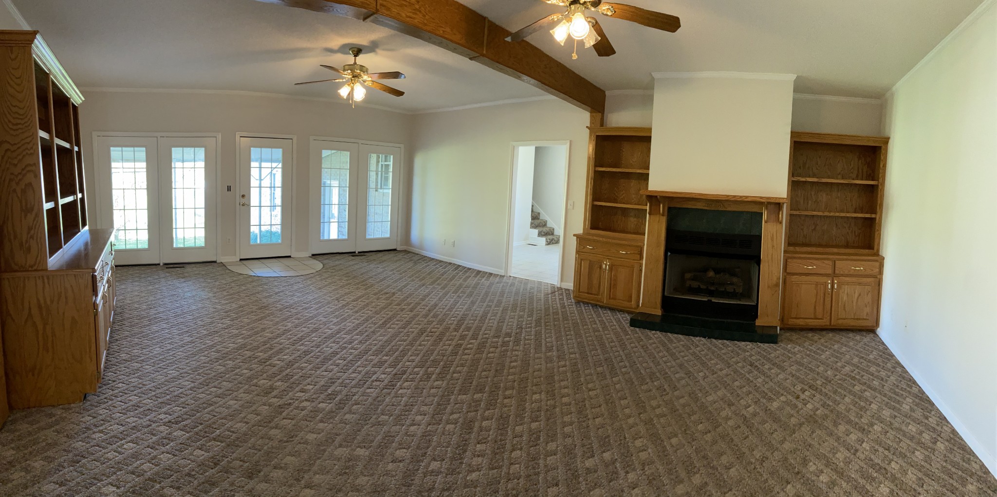 1370 Shelly Road Decherd, TN 37324 - Photo 22 of 44 a view of an empty room with a fireplace and a window