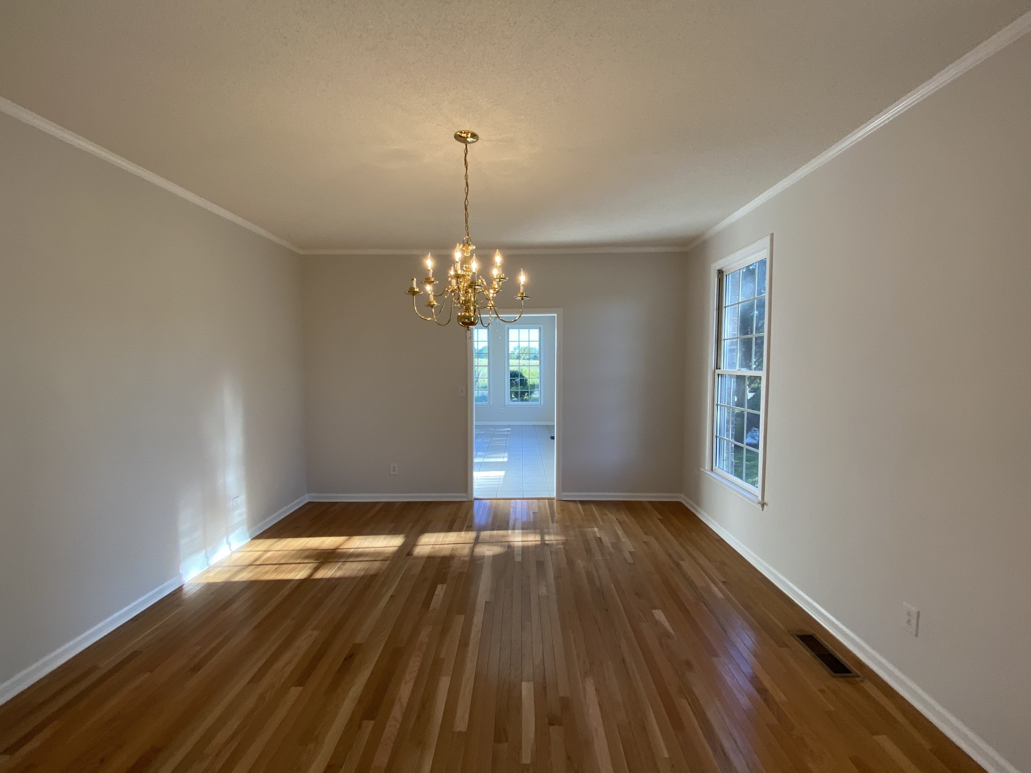 1370 Shelly Road Decherd, TN 37324 - Photo 23 of 44 a view of a room with wooden floor chandelier and a window