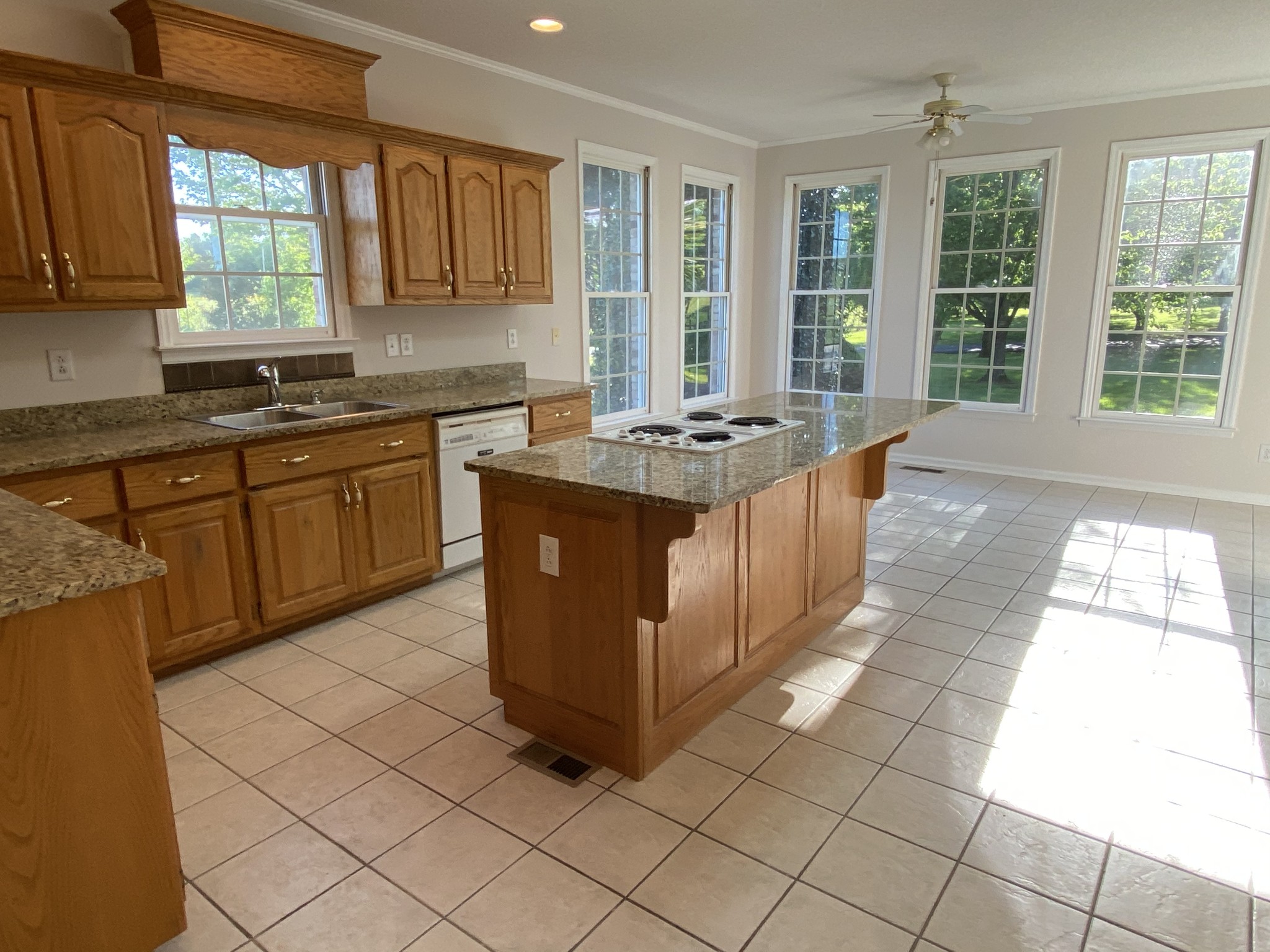 1370 Shelly Road Decherd, TN 37324 - Photo 25 of 44 a kitchen with stainless steel appliances granite countertop a stove a sink and a microwave