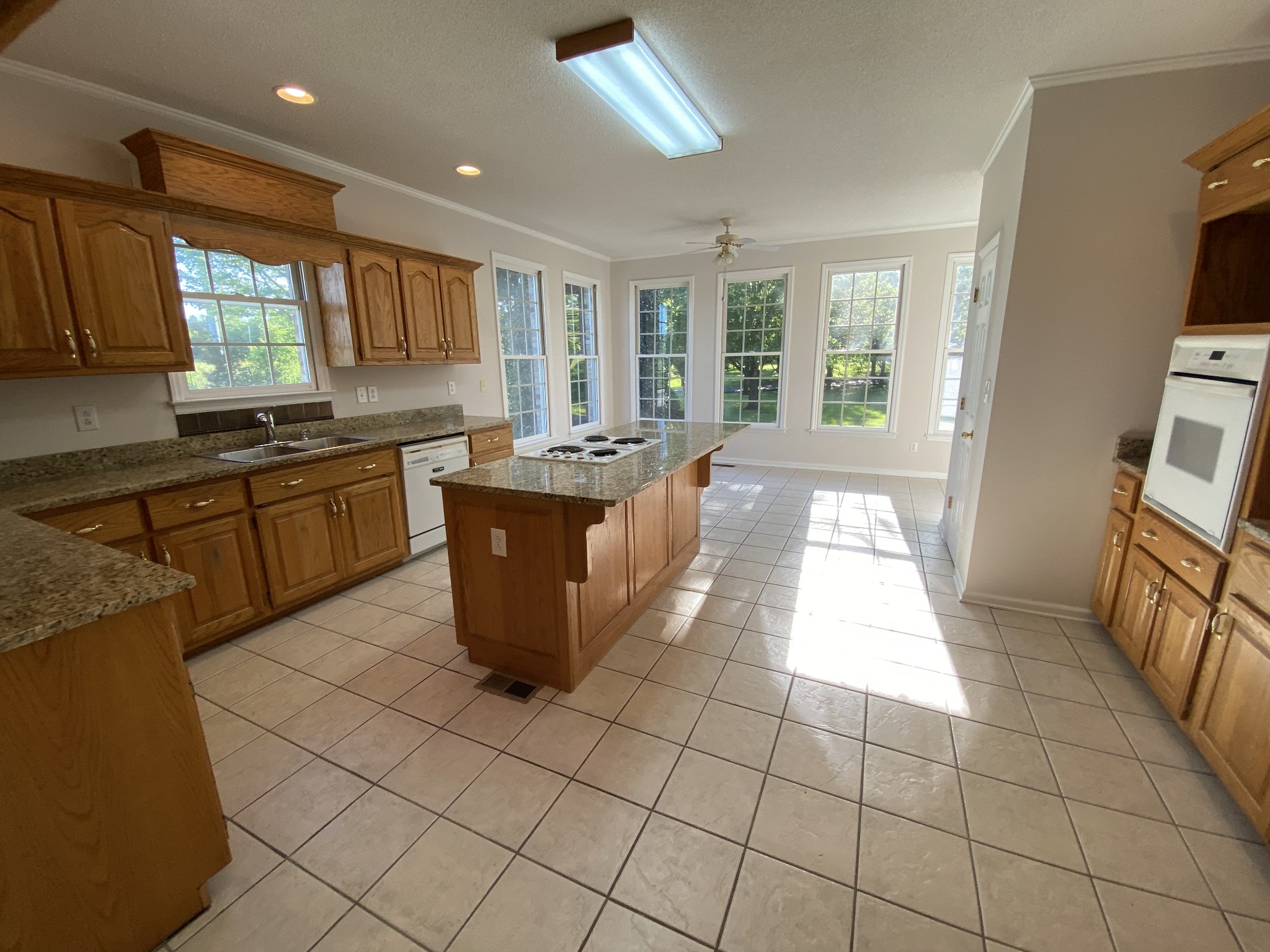 1370 Shelly Road Decherd, TN 37324 - Photo 26 of 44 a kitchen with stainless steel appliances granite countertop a sink and a stove