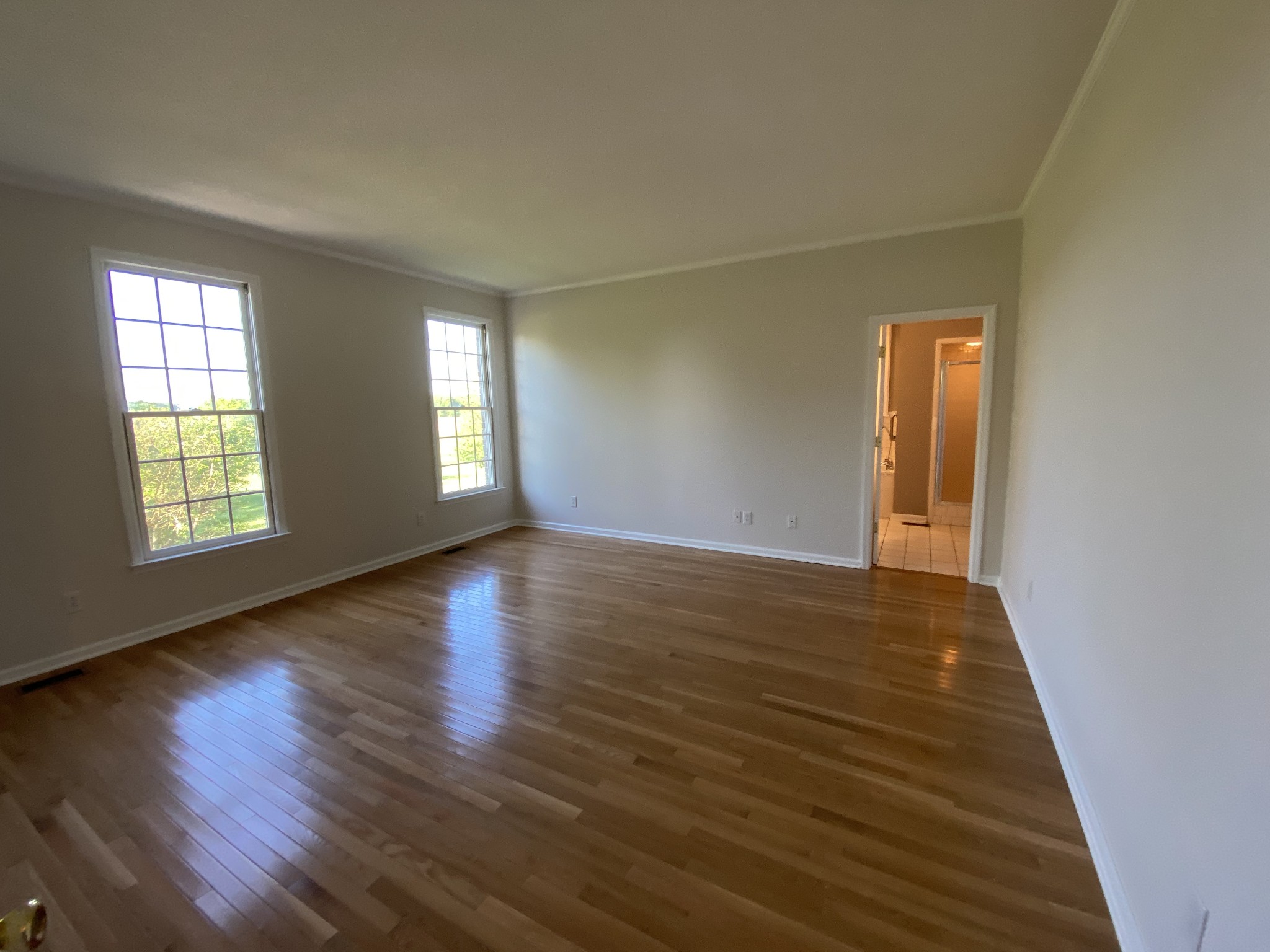 1370 Shelly Road Decherd, TN 37324 - Photo 28 of 44 a view of an empty room with wooden floor and a window