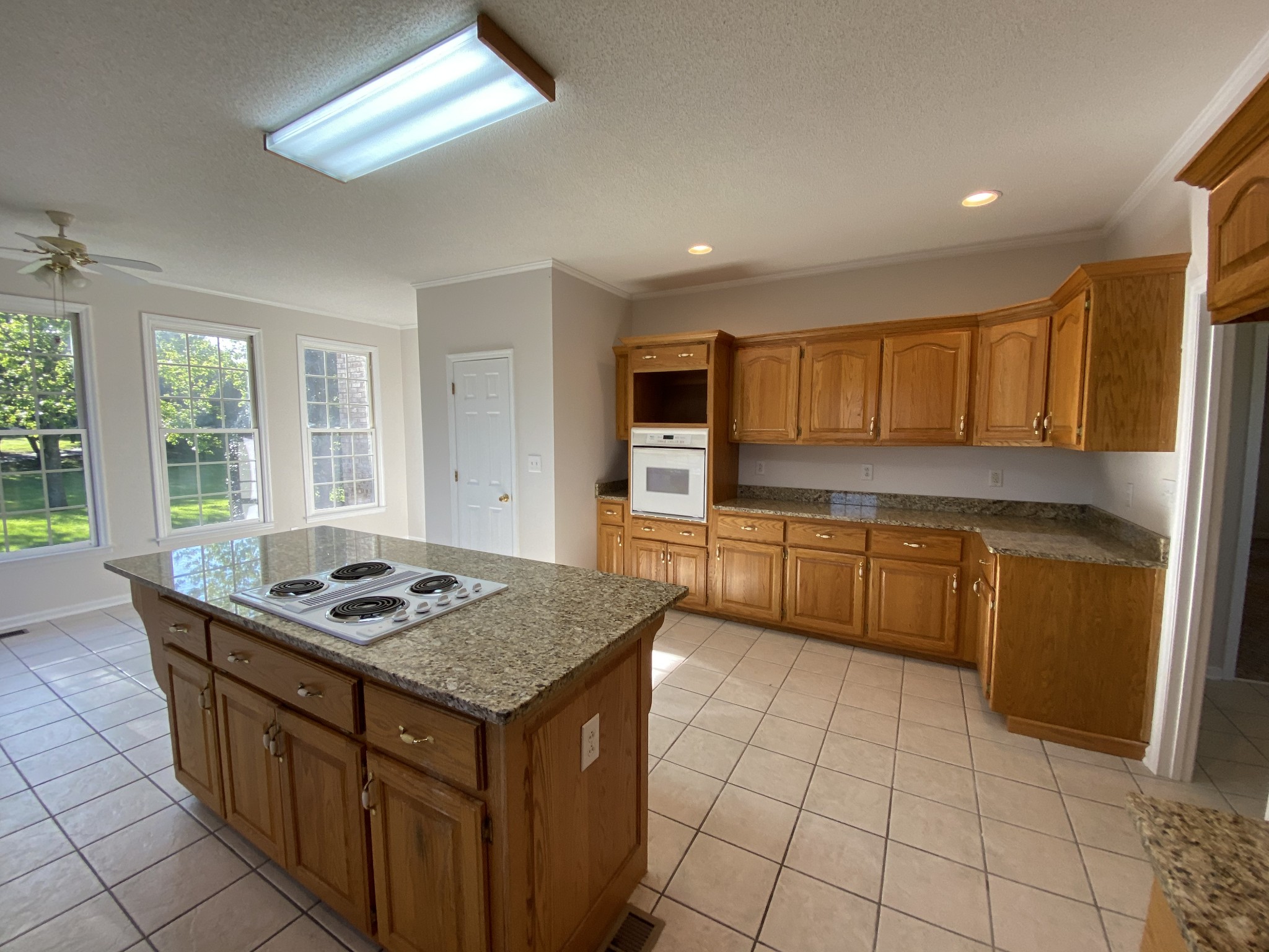 1370 Shelly Road Decherd, TN 37324 - Photo 30 of 44 a kitchen with stainless steel appliances granite countertop a stove a sink and a microwave