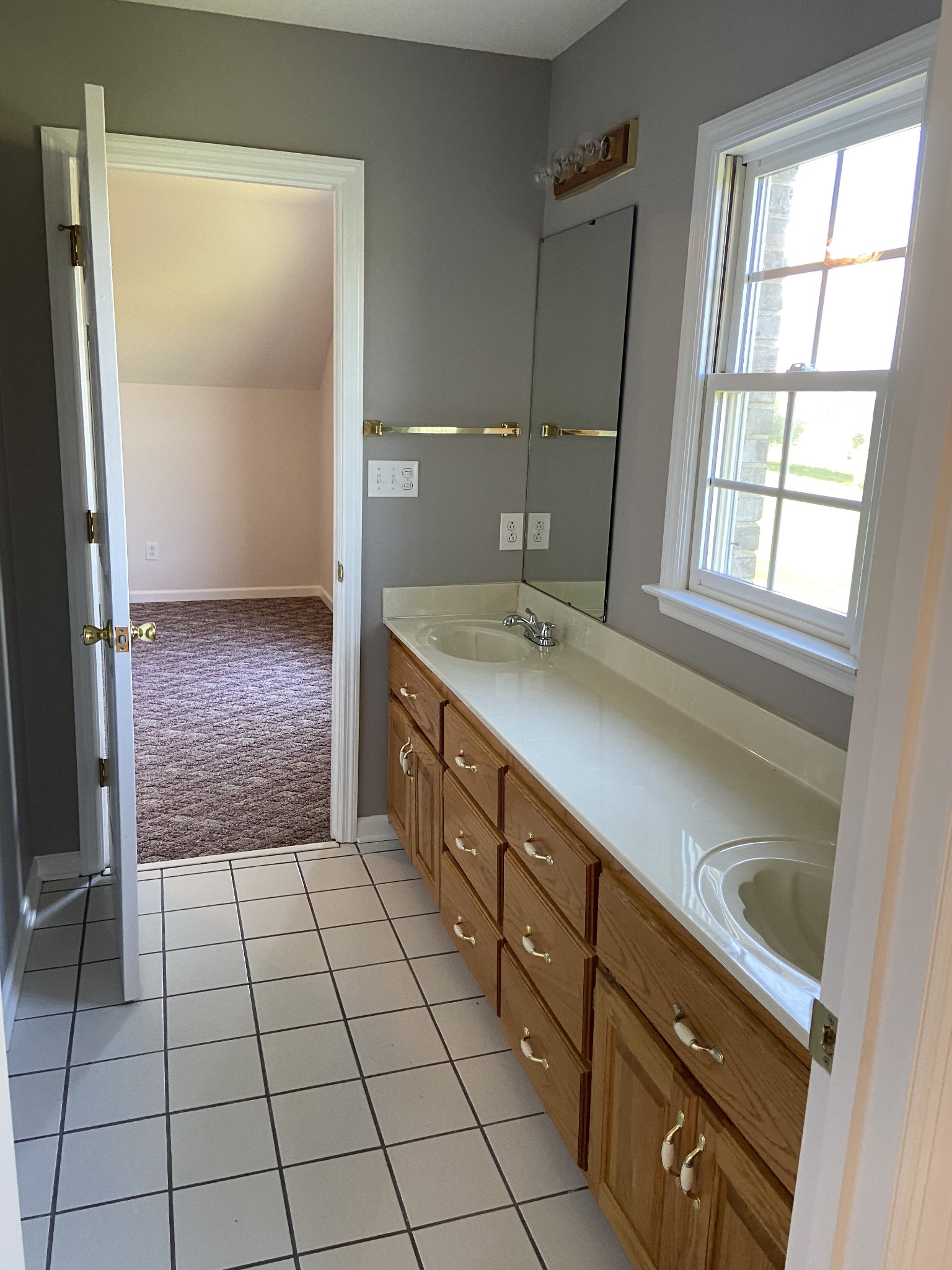 1370 Shelly Road Decherd, TN 37324 - Photo 35 of 44 a bathroom with a sink a vanity and a mirror