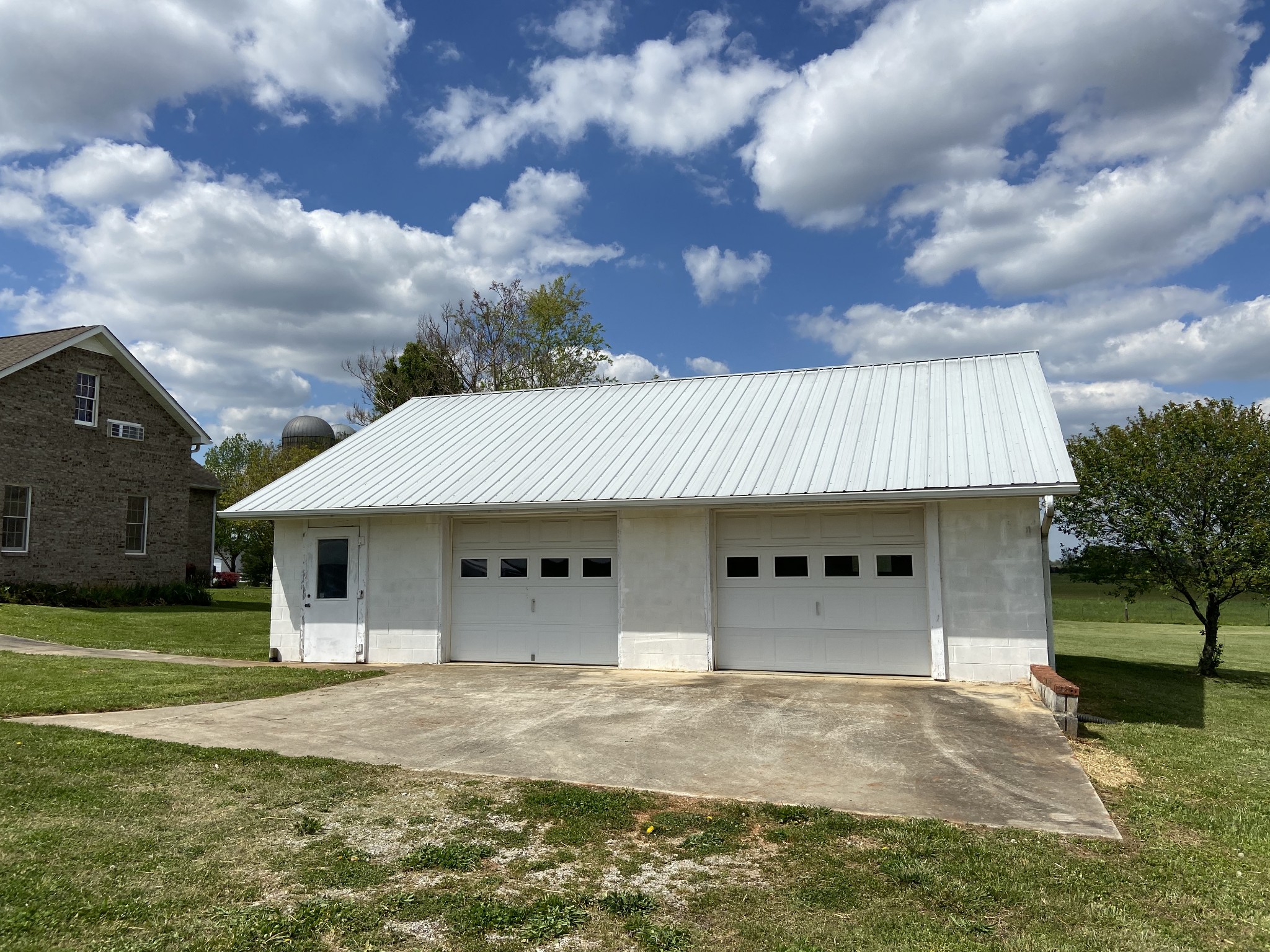 1370 Shelly Road Decherd, TN 37324 - Photo 42 of 44 a front view of a house with a garden and trees
