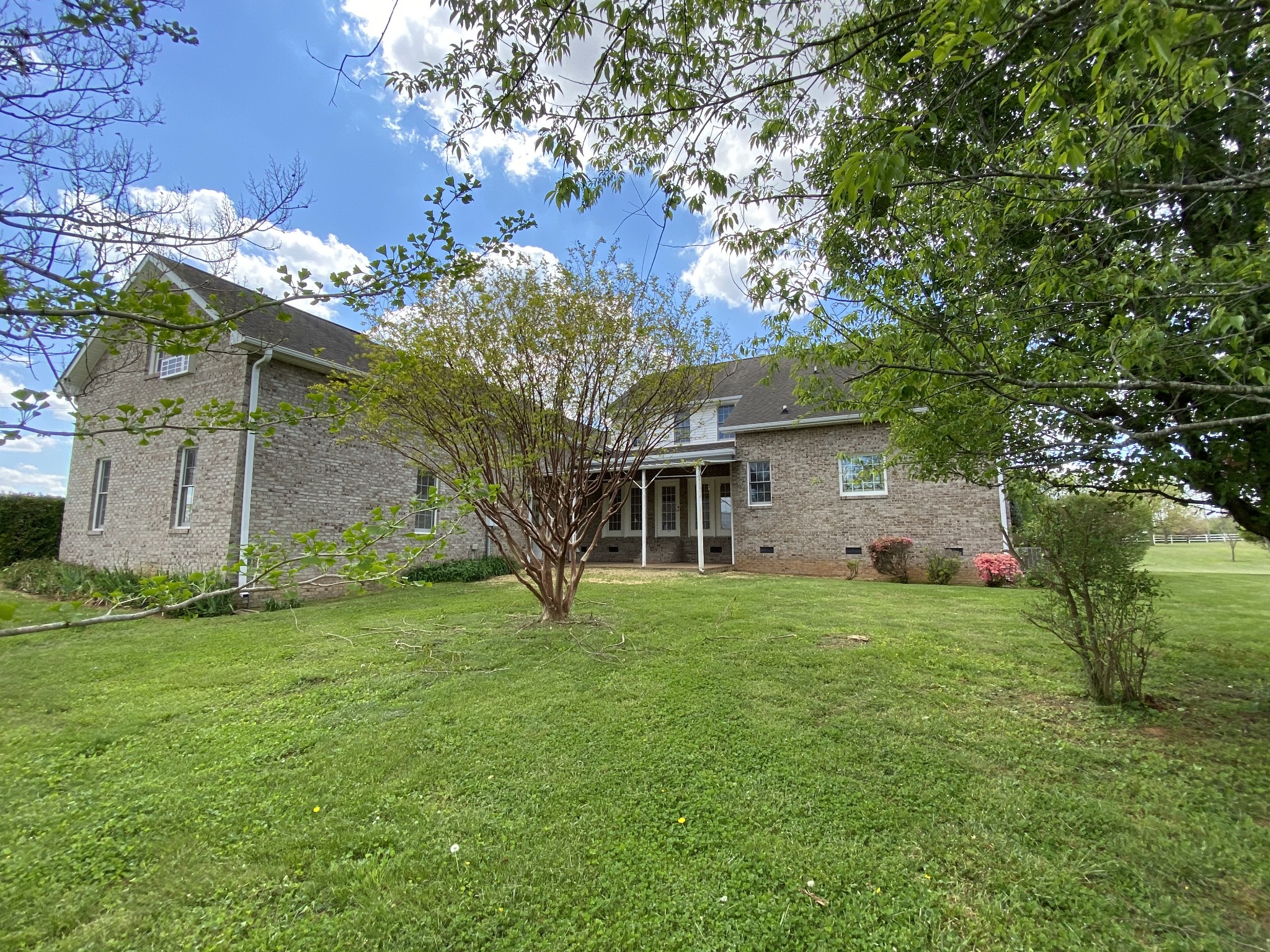 1370 Shelly Road Decherd, TN 37324 - Photo 10 of 44 a yellow house sitting in middle of the grass
