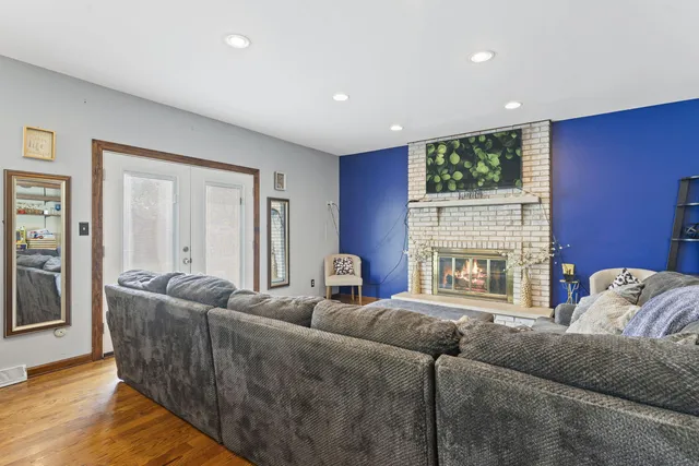 a living room with furniture and a fireplace