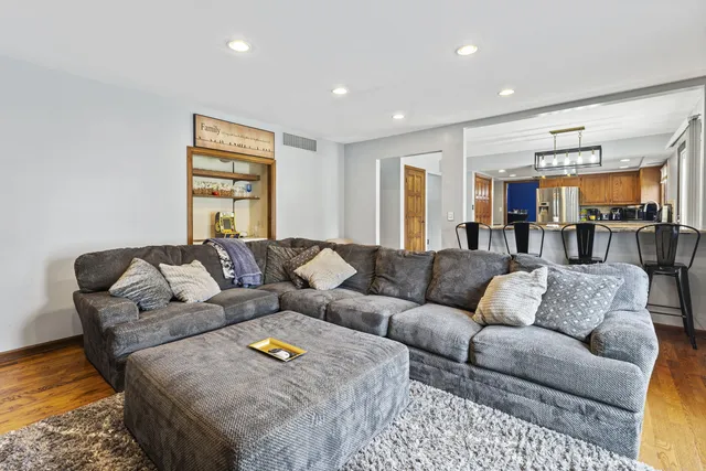 a living room with furniture and a rug