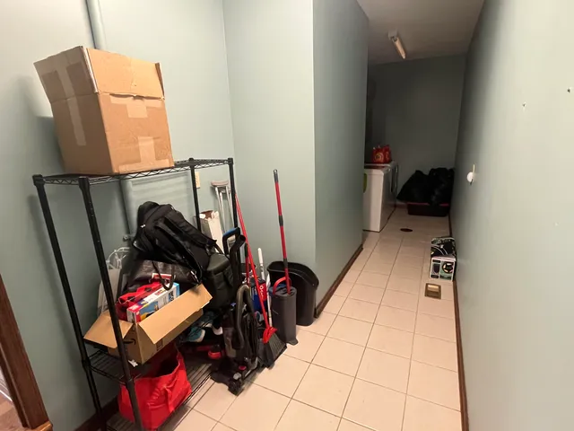 a bathroom with a granite countertop sink a toilet and mirror