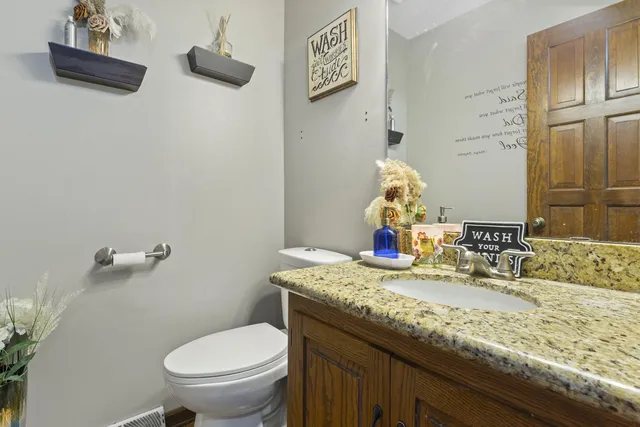 a spacious bedroom with a bed and window