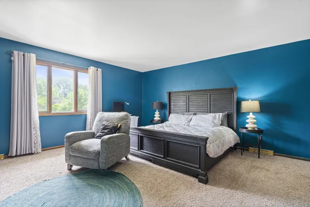 a bedroom with a bed and a couch