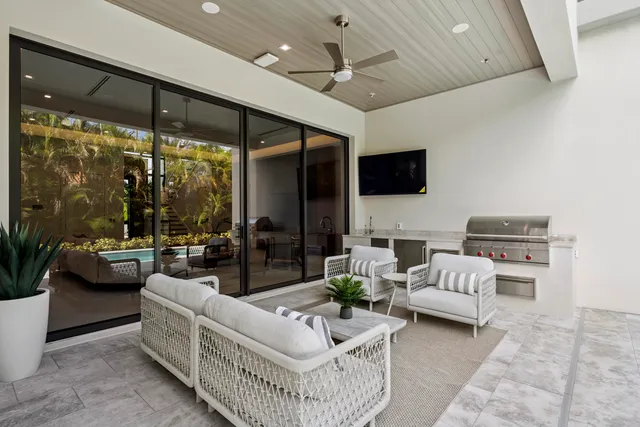 a view of a livingroom with furniture window and wooden floor