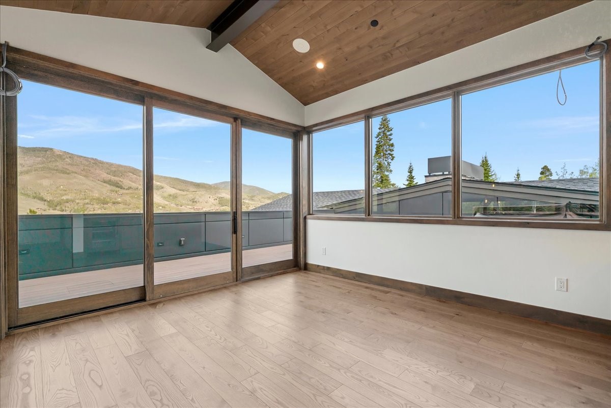 1615 Golden Eagle Road Silverthorne, CO 80498 - Photo 42 of 47 a view of an empty room with wooden floor and a window