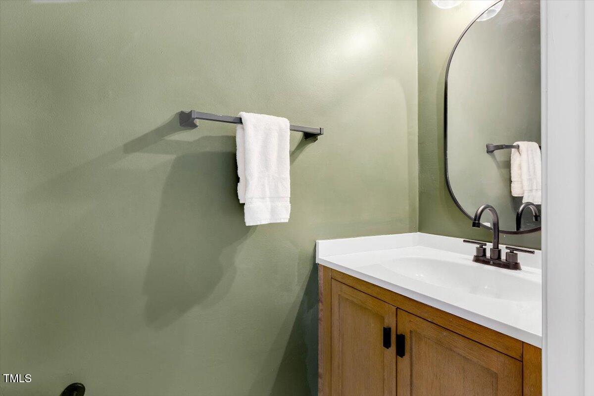 6910 Saxby Court Raleigh, NC 27613 - Photo 17 of 26 downstairs half bath