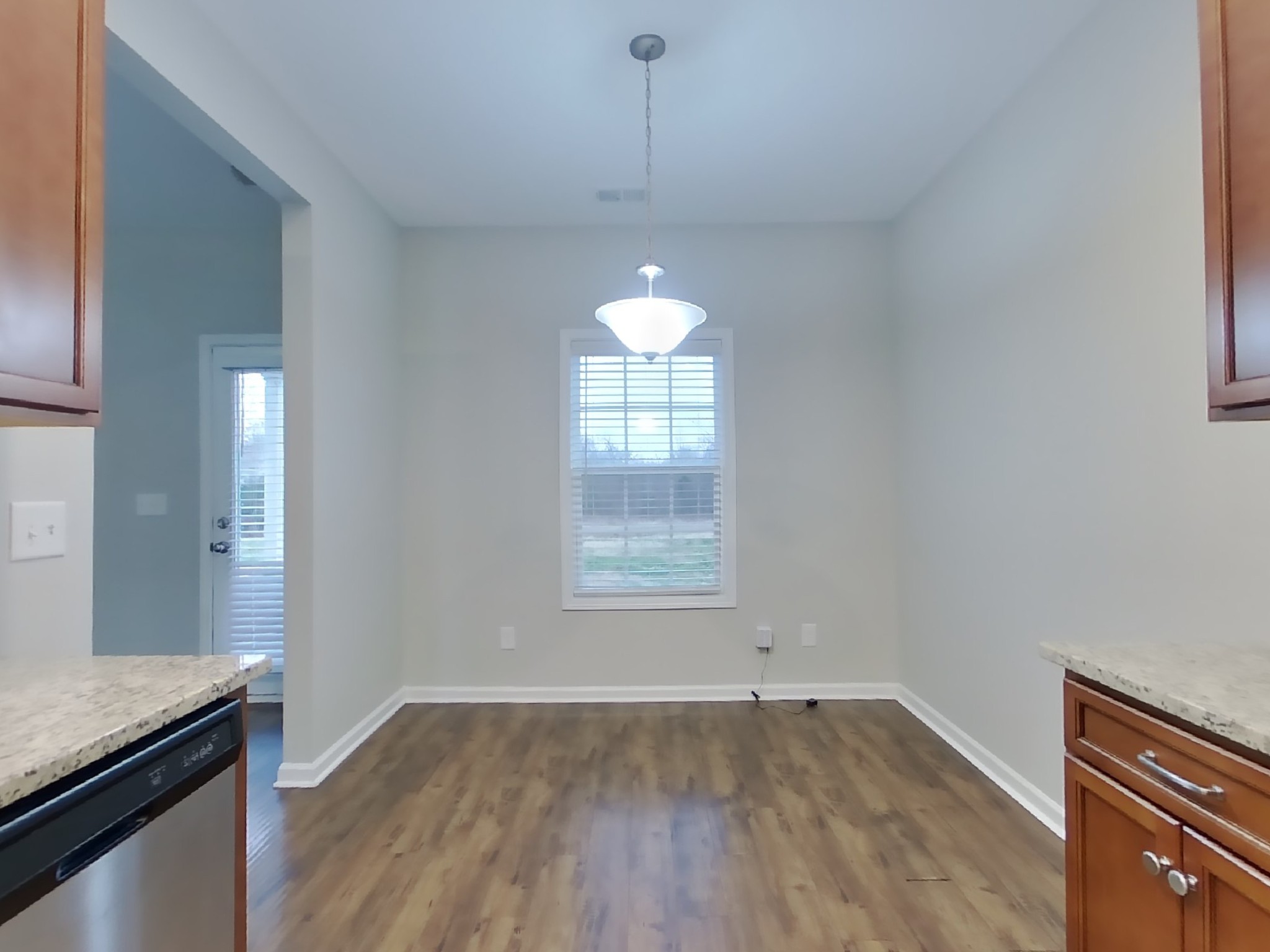 809 Ellyson Drive Spring Hill, TN 37174 - Photo 5 of 17 an empty room with wooden floor and windows