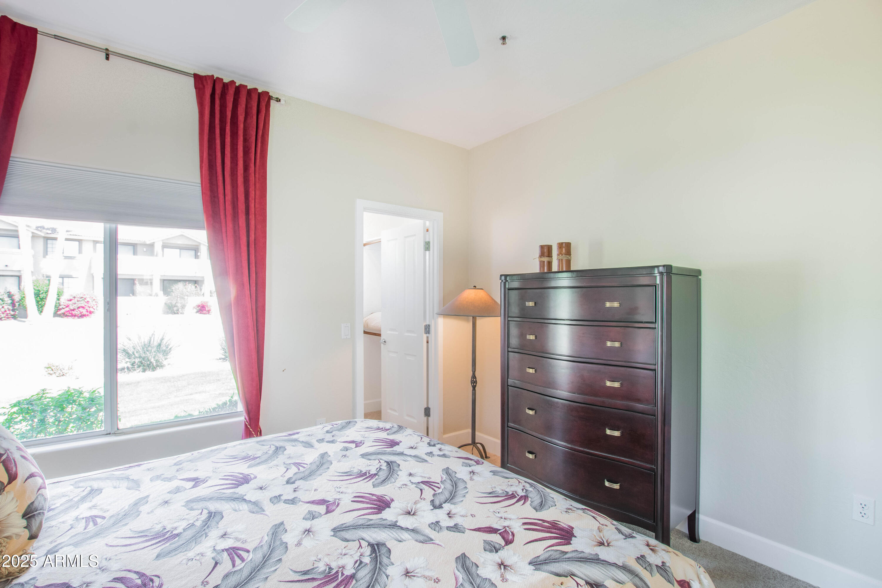 11260 North 92nd Street, Unit 1107 Scottsdale, AZ 85260 - Photo 15 of 20 a bedroom with a bed and a window