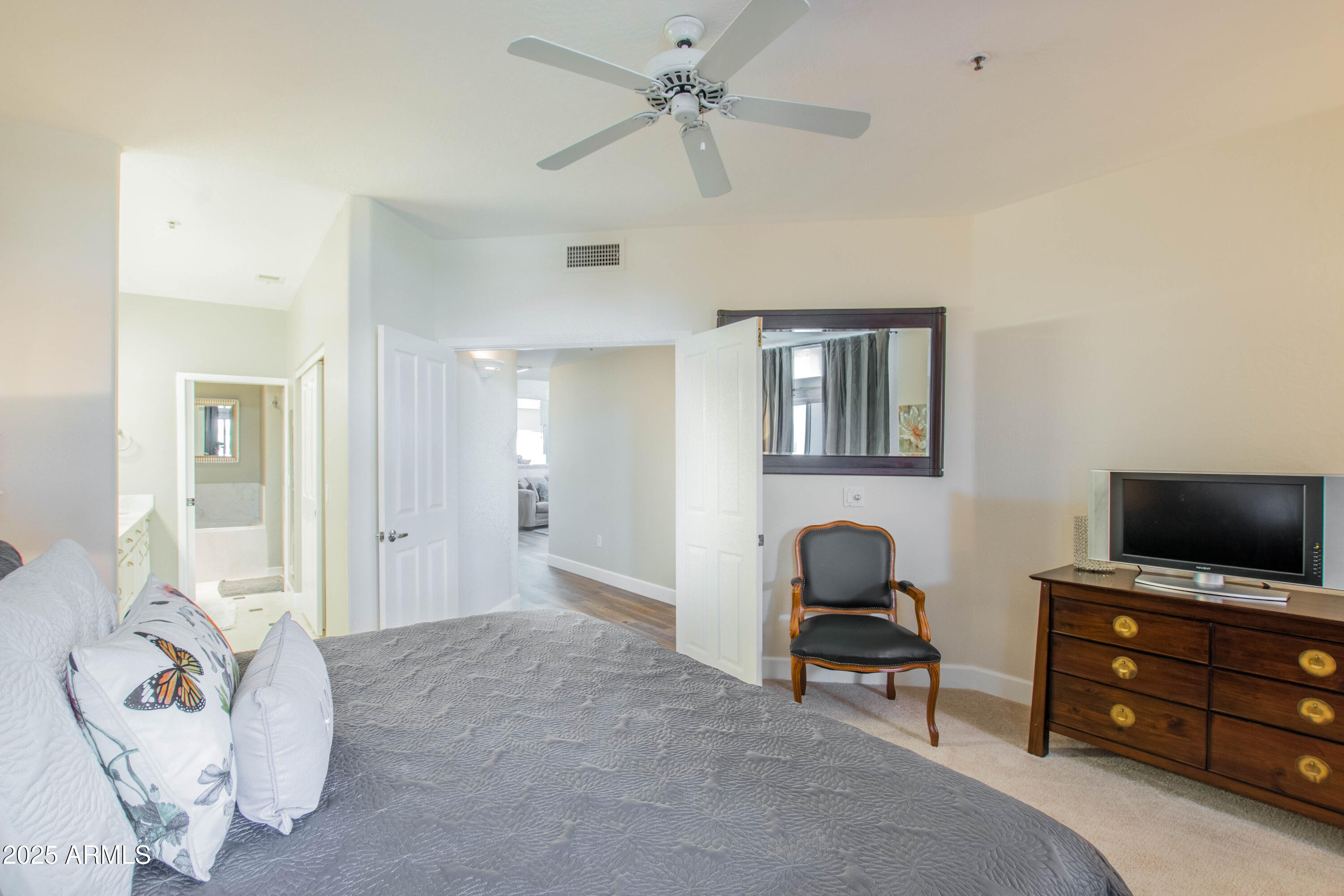 11260 North 92nd Street, Unit 1107 Scottsdale, AZ 85260 - Photo 10 of 20 a living room with furniture and a flat screen tv