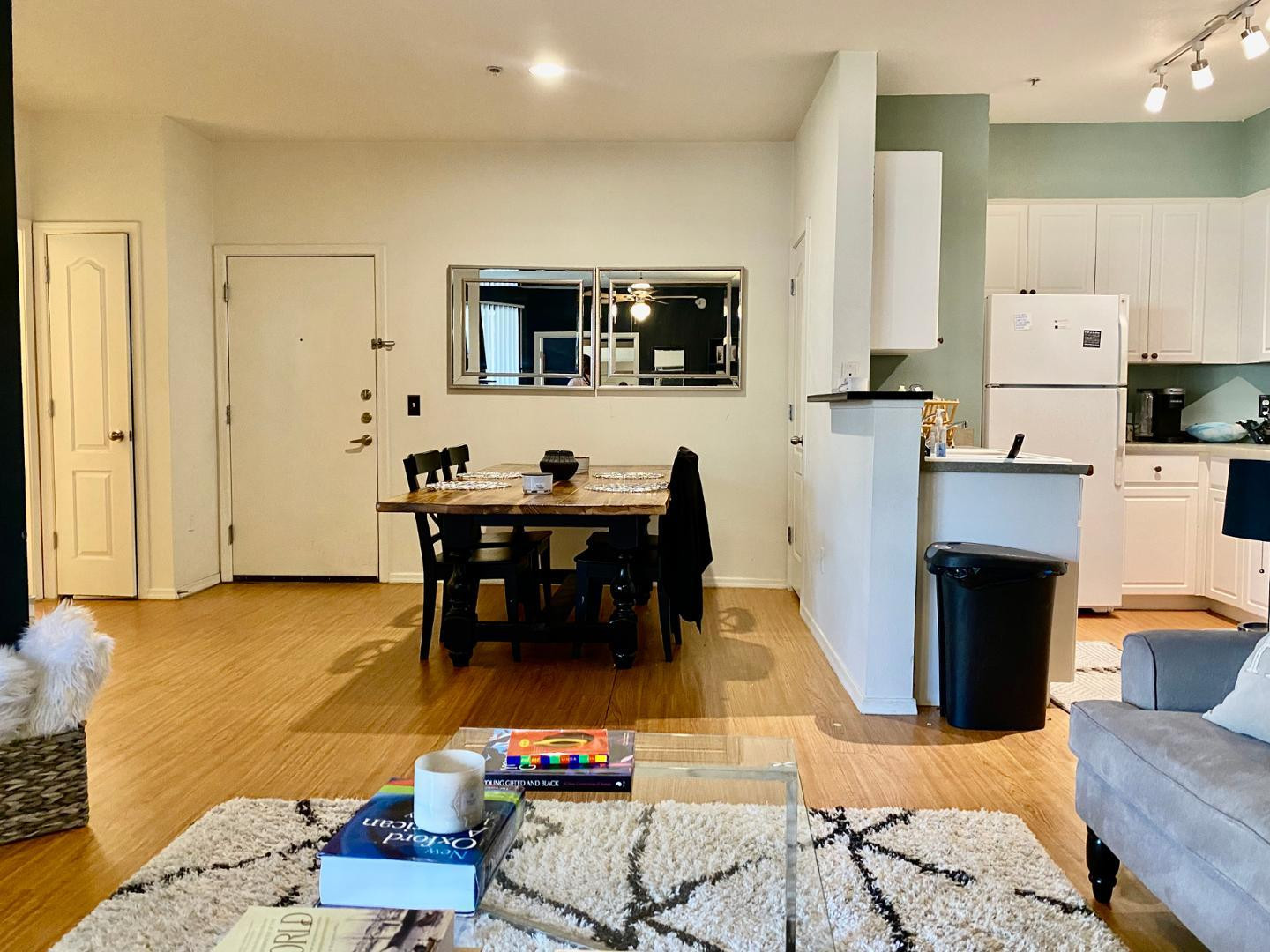 1701 East Colter Street, Unit 388 Phoenix, AZ 85016 - Photo 15 of 22 a living room with furniture a flat screen tv and kitchen view