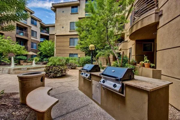 a view of a patio with chairs and tables