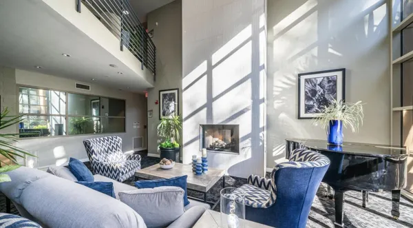 a living room with furniture and a large window