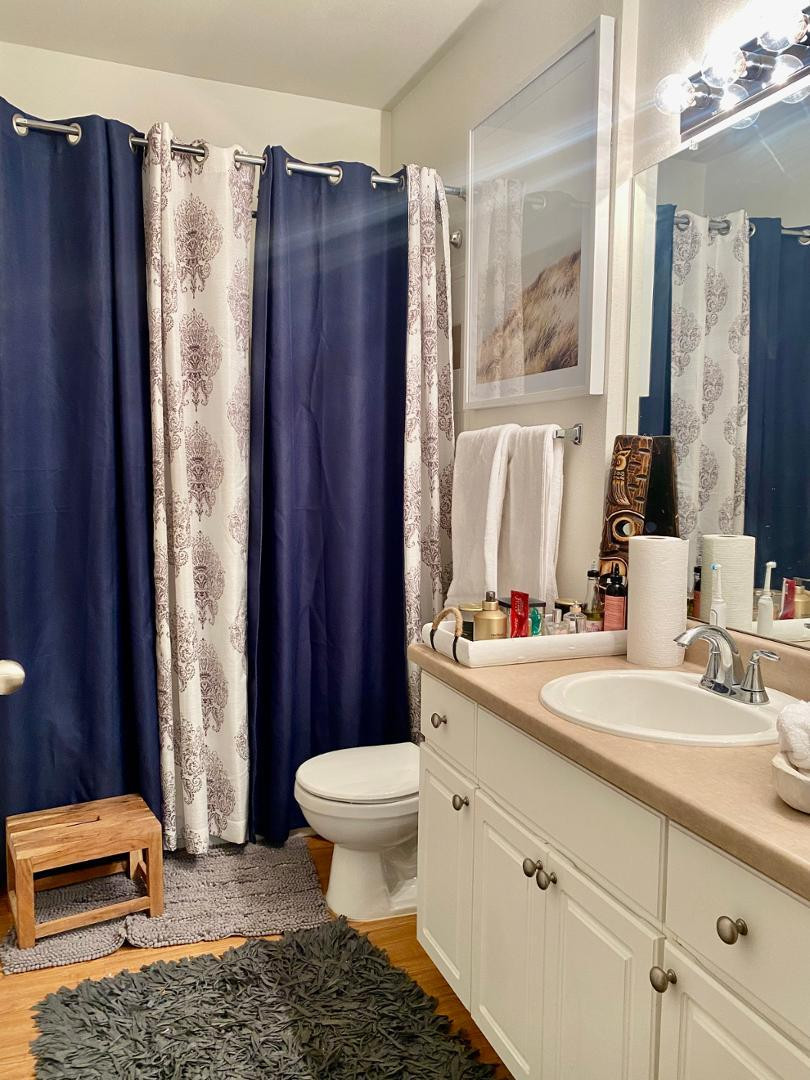 1701 East Colter Street, Unit 388 Phoenix, AZ 85016 - Photo 4 of 22 a bathroom with a sink a toilet and shower