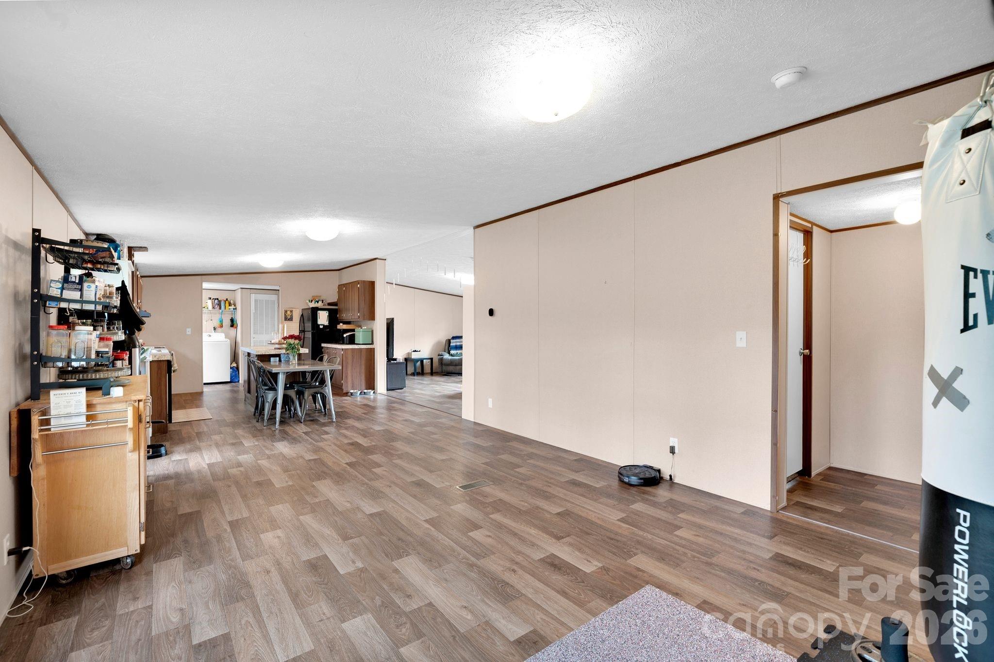 812 Dallas Spencer Mountain Road Dallas, NC 28034 - Photo 11 of 35 a view of a livingroom with furniture and an empty room