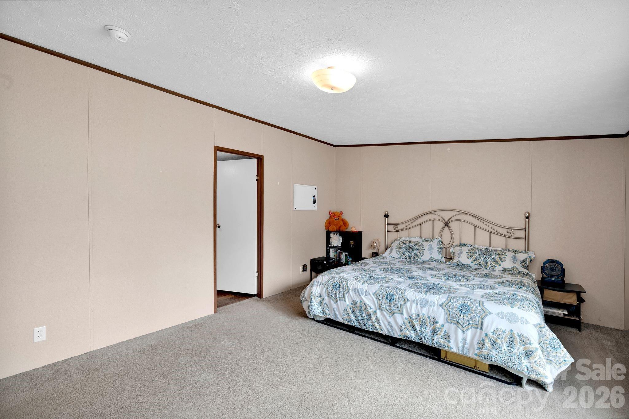 812 Dallas Spencer Mountain Road Dallas, NC 28034 - Photo 23 of 35 a bedroom with bed and a window