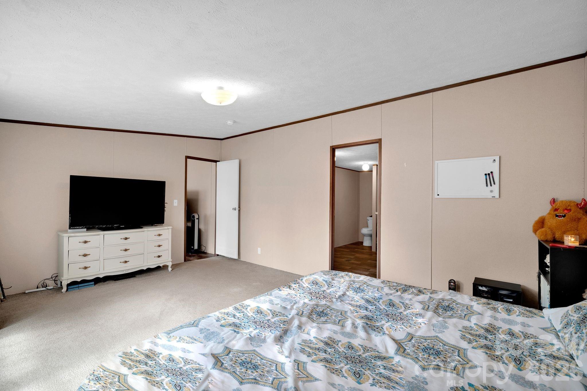 812 Dallas Spencer Mountain Road Dallas, NC 28034 - Photo 24 of 35 a view of a livingroom with a flat screen tv